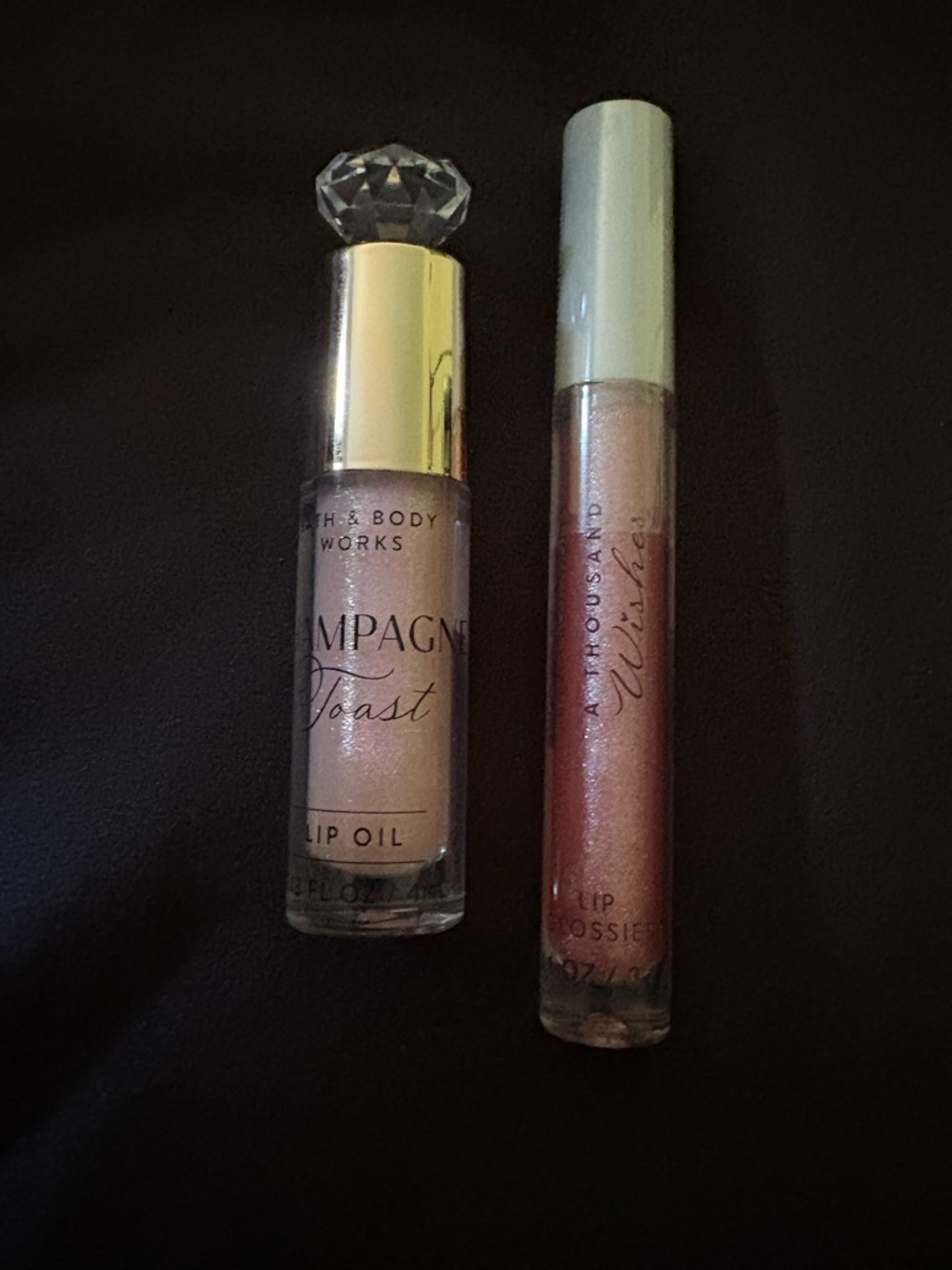 Bath & Body Works Champagne Toast Lip Oil & A Thousand Wishes Shimmery lip gloss